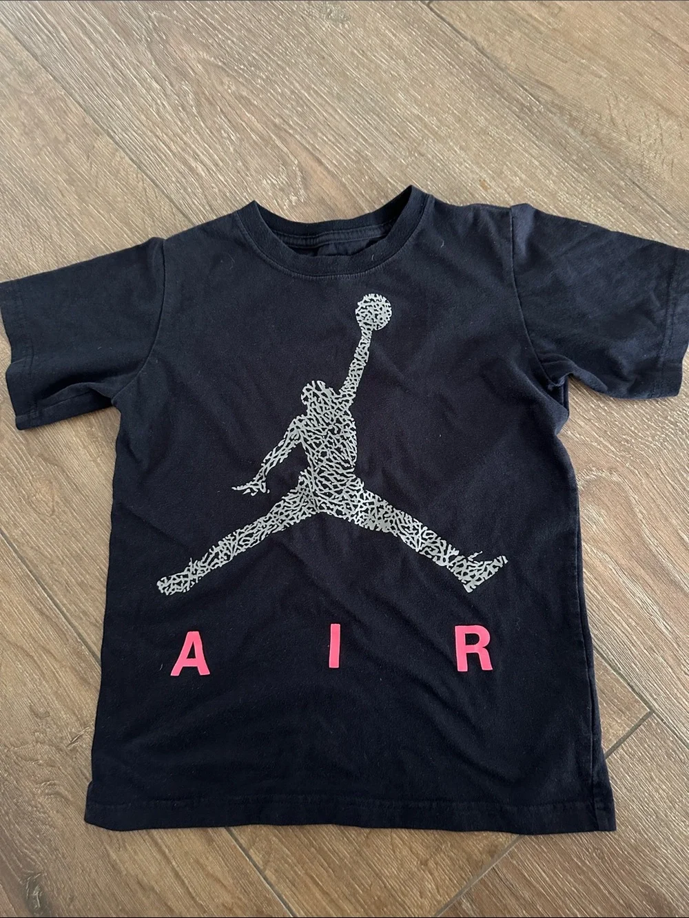 Nike AIR boys Black Tee with White Jumpman and Pink AIR Lettering. Size S.